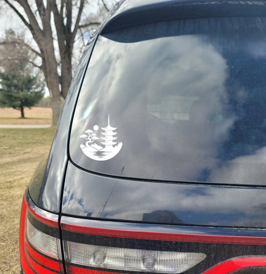 Car window with a white decal of a pagoda