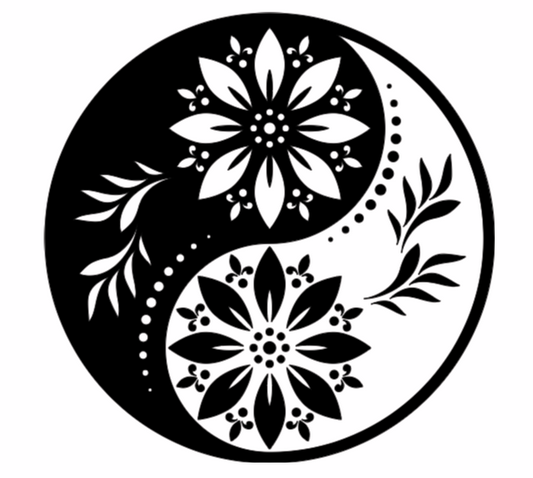 Yin yang symbol with floral designs in black and white on a white background